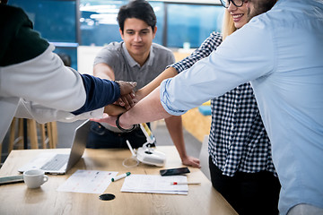 Image showing multiethnic Group of young business people celebrating success