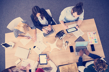 Image showing top view of multiethnic business team learning about drone techn