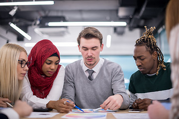 Image showing Multiethnic startup business team having meeting