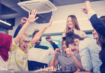 Image showing multiethnic group of business people playing chess