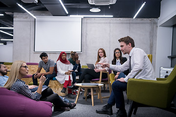 Image showing Multiethnic startup business team having meeting