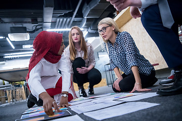 Image showing black muslim woman having meeting with Multiethnic  startup busi