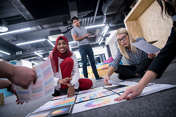 Image showing black muslim woman having meeting with Multiethnic  startup busi