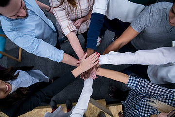 Image showing multiethnic Group of young business people celebrating success