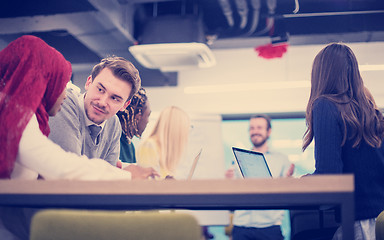 Image showing Multiethnic startup business team having meeting