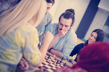 Image showing multiethnic group of business people playing chess