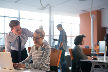 Image showing Two Business People Working With laptop in office