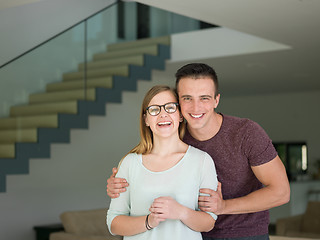 Image showing couple hugging in their new home