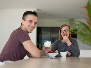 Image showing couple enjoying morning coffee and strawberries