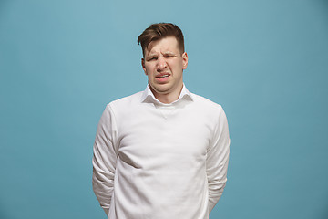 Image showing Beautiful bored man isolated on studio background