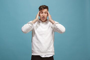 Image showing Man having headache. Isolated over background.