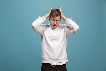 Image showing Man having headache. Isolated over background.