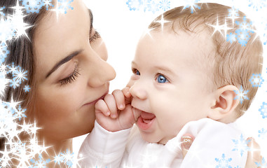 Image showing smiling baby in mother hands