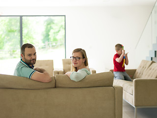 Image showing family with little boy enjoys in the modern living room