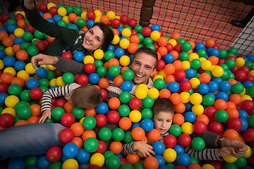 Image showing young parents with kids in a children\'s playroom