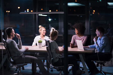 Image showing Multiethnic startup business team in night office