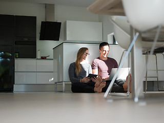 Image showing couple using tablet and laptop computers