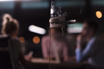 Image showing Multiethnic startup business team in night office