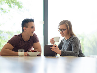 Image showing couple enjoying morning coffee and strawberries