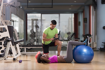 Image showing pilates  workout with personal trainer at gym