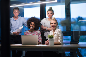 Image showing Multiethnic startup business team in night office