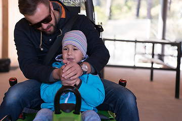 Image showing father and son enjoys driving on alpine coaster