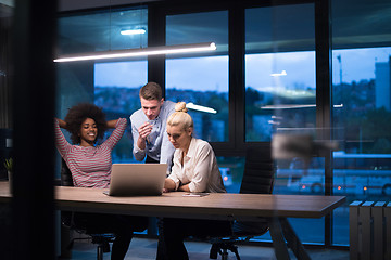 Image showing Multiethnic startup business team in night office