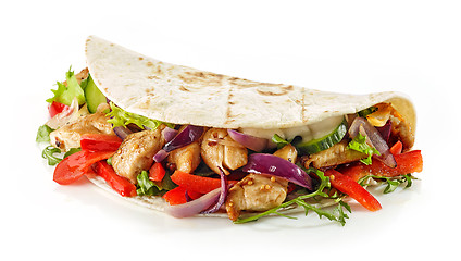 Image showing Tortilla wrap with fried chicken meat and vegetables