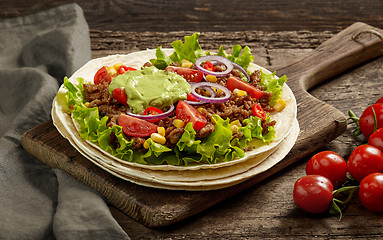 Image showing Tortilla wrap with fried minced meat and vegetables 