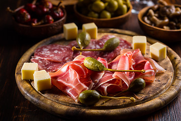 Image showing Serrano ham platter with variation of appetizers