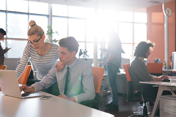 Image showing Two Business People Working With laptop in office