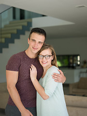 Image showing couple hugging in their new home