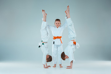 Image showing The boys fighting at Aikido training in martial arts school. Healthy lifestyle and sports concept