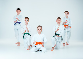 Image showing The group of boys and girl fighting at Aikido training in martial arts school. Healthy lifestyle and sports concept