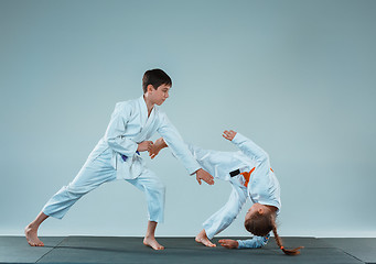 Image showing The boy fighting at Aikido training in martial arts school. Healthy lifestyle and sports concept