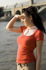 Image showing woman looking at river water