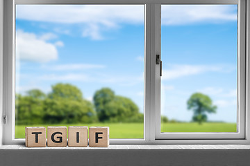 Image showing TGIF weekend sign in a white window