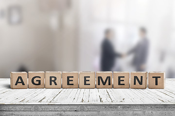 Image showing Agreement sing on a word with business men 