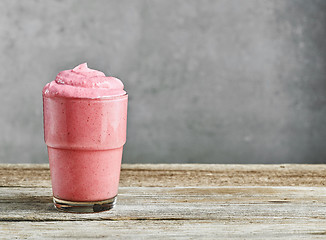 Image showing glass of pink milkshake