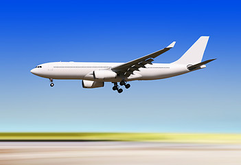 Image showing plane landing over runway of airport