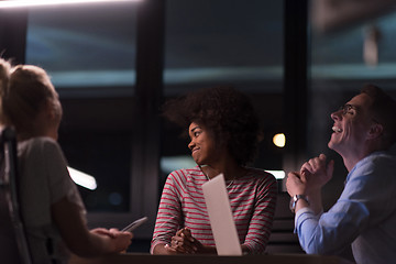 Image showing Multiethnic startup business team in night office