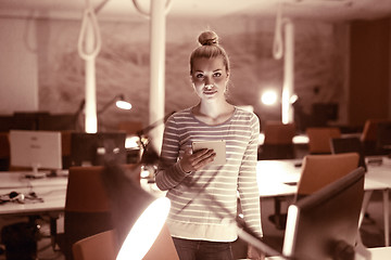 Image showing woman working on digital tablet in night office