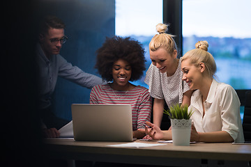 Image showing Multiethnic startup business team in night office