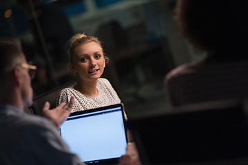 Image showing Multiethnic startup business team in night office