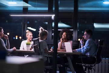 Image showing Multiethnic startup business team in night office