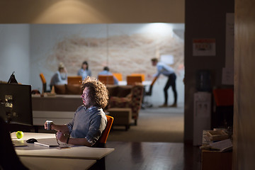 Image showing Tired businessman working late