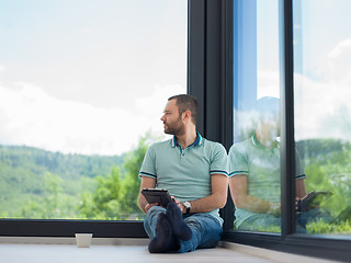 Image showing man on the floor enjoying relaxing lifestyle