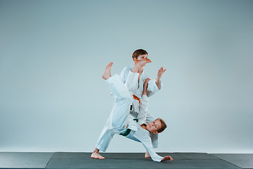 Image showing The two boys fighting at Aikido training in martial arts school. Healthy lifestyle and sports concept