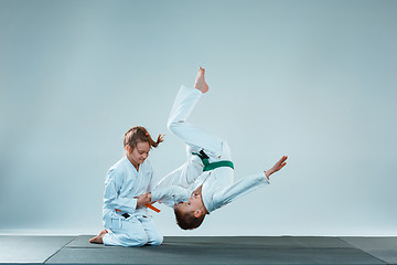 Image showing The boy fighting at Aikido training in martial arts school. Healthy lifestyle and sports concept