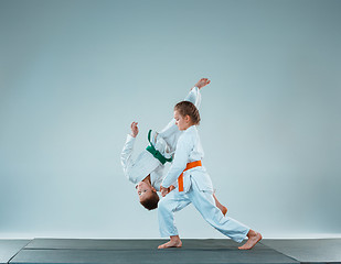 Image showing The boy fighting at Aikido training in martial arts school. Healthy lifestyle and sports concept